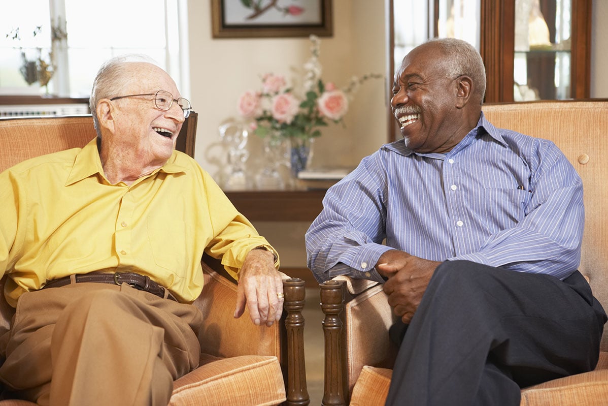 Residents laughing together at Providence Meadows